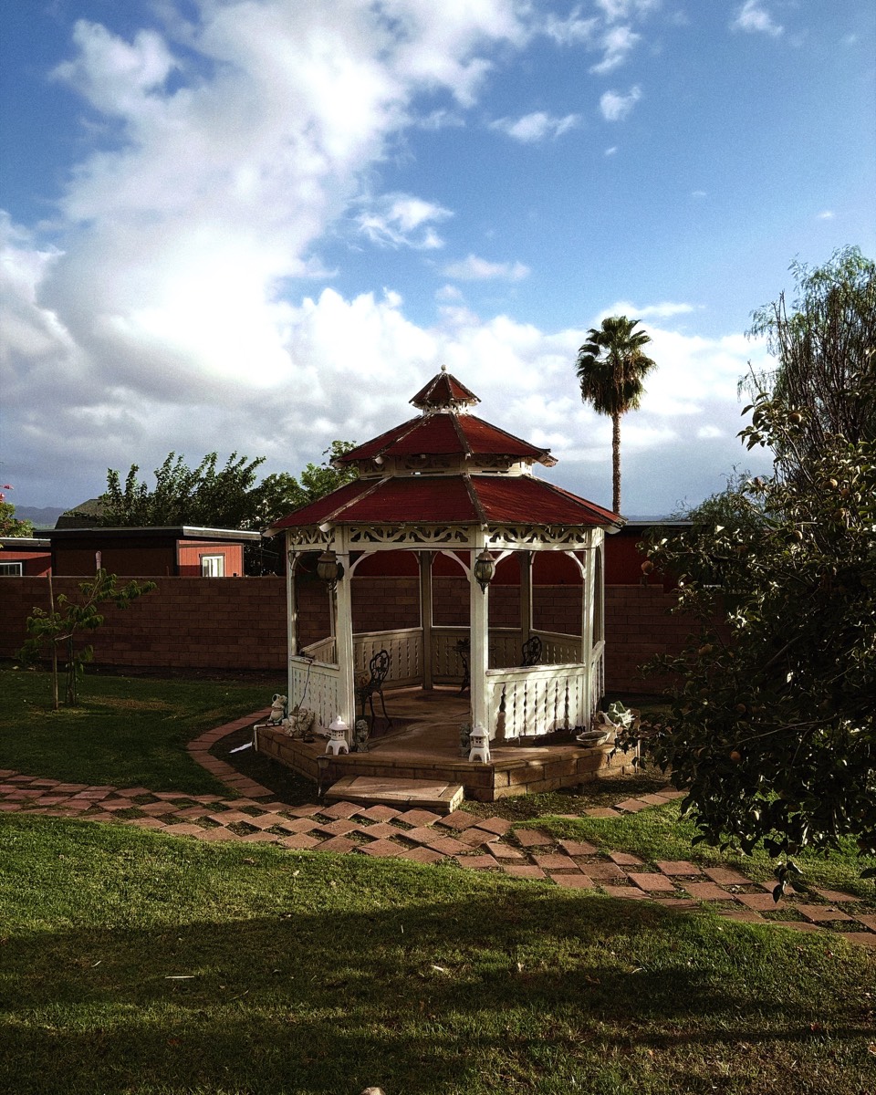 A gazebo under clouds, shot in the Olivo look